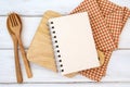 book notepad paper on chopping cutting board and tablecloth on white table , a recipes food  for healthy habits shot note Royalty Free Stock Photo