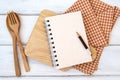 Book notepad paper on a chopping cutting board and tablecloth on white table , recipes food  for healthy habits shot note Royalty Free Stock Photo