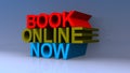 Book online now on blue Royalty Free Stock Photo