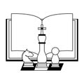 Book open with chess pieces in black and white Royalty Free Stock Photo