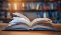 A book is open on a table with a library background Royalty Free Stock Photo
