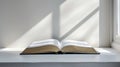 A book open on a white table with sunlight shining through the window, AI Royalty Free Stock Photo