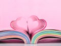 Book with opened pages and shape of heart. Royalty Free Stock Photo