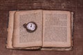 A book over a hundred years old and a watch from 1850