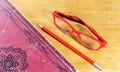 Book, pen and pair of red glasses Royalty Free Stock Photo