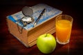 Book with pen,watch apple and orange juice. Royalty Free Stock Photo