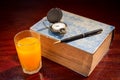 Book with pen,watch and orange juice. Royalty Free Stock Photo