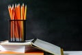 book and pencil on white table black board background with study Royalty Free Stock Photo
