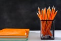 book and pencil on white table black board background with study Royalty Free Stock Photo