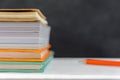 book and pencil on white table black board background with study Royalty Free Stock Photo