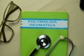 The Book of Polymalgia Heumatica on office desk Royalty Free Stock Photo