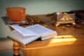 The book with prayers of the orthodox father lies on a table before the sacrament of baptism