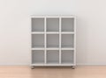 Book rack isolated against the white wall in bright interior Royalty Free Stock Photo
