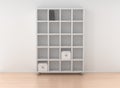 Book rack isolated against the white wall in bright interior Royalty Free Stock Photo