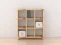 Book rack isolated against the white wall in bright interior Royalty Free Stock Photo