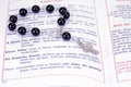 A book and rosary beads