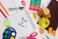 Book and school accessories on white boards, back to school concept Royalty Free Stock Photo