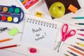 Book and school accessories on white boards, back to school concept Royalty Free Stock Photo