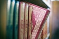 A book is selected from bookshelf in public library