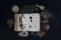 Book of Shadows with lunar phases on black altar. Royalty Free Stock Photo