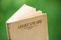 Book by Shakespeare on Green Background Royalty Free Stock Photo