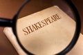Book by Shakespeare on through Magnifying Glass