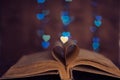 Book sheets heart and background bokeh heart Royalty Free Stock Photo