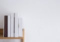 Book shelf blank spines, empty binding stack on wood texture background Royalty Free Stock Photo