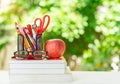 Book stack, glasess, stationery and apple paste on table Royalty Free Stock Photo