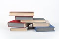 Book stack, hardback colorful books on wooden table, white background. Back to school. Copy space for text. Education business Royalty Free Stock Photo