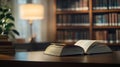 Book stack and opened book on the desk on blurred bookshelves in light public library room background Royalty Free Stock Photo