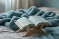 book stand and book on bed,
