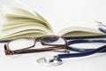 Book, Stethoscope and Glasses - Conceptual Royalty Free Stock Photo