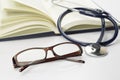 Book, Stethoscope and Glasses - Conceptual Royalty Free Stock Photo
