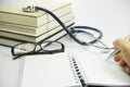 Book, Stethoscope and Glasses - Conceptual Royalty Free Stock Photo