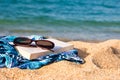 Book, sunglasses on a beach Royalty Free Stock Photo