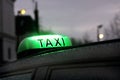 Paris Lighting taxi sign on the roof in rainy day