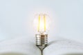 Book or textbook with bright lightbulb. Learning or training skill course or classroom online at home. Conceptual success idea of
