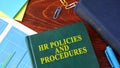 Book with title HR policies and procedures. Royalty Free Stock Photo