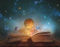 Book of the universe - opened magic book with planets and galaxies