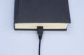 Book and usb cable Royalty Free Stock Photo