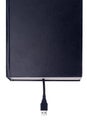 a book with a USB plug coming out of its pages Royalty Free Stock Photo