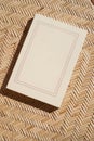 Book on wicker straw background. Blank book cover with copy space Royalty Free Stock Photo