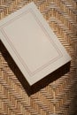 Book on wicker straw background. Blank book cover cover with copy space Royalty Free Stock Photo