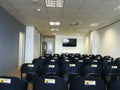 Book your space. Large conference room with empty chairs
