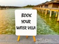 Book your Watervilla: booking a flight or hotel for vacancies. Royalty Free Stock Photo