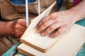 Bookbinding. Male worker binding pages.