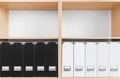 Bookcase with black and white folders
