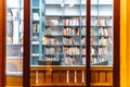 Bookcase racks in the public night library interior knowledge university Royalty Free Stock Photo