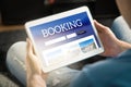 Booking app or website on tablet screen.